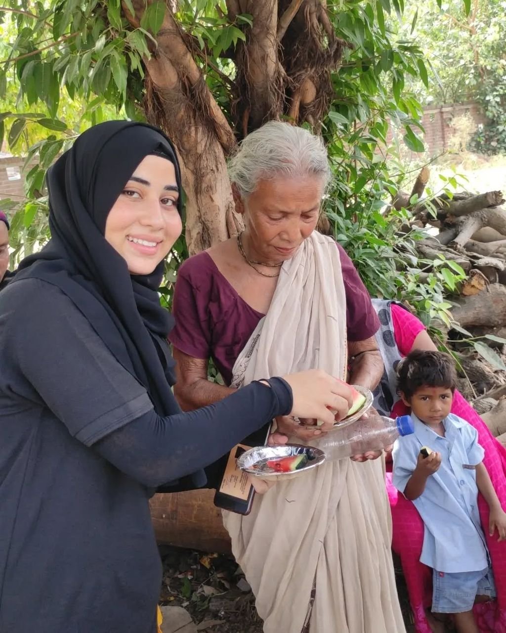 A smiling volunteer serving food with love